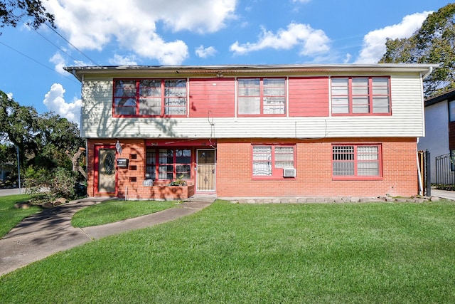 view of front facade with a front lawn and cooling unit