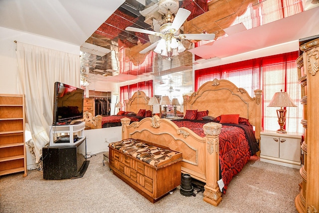 bedroom featuring carpet, ceiling fan, and a closet