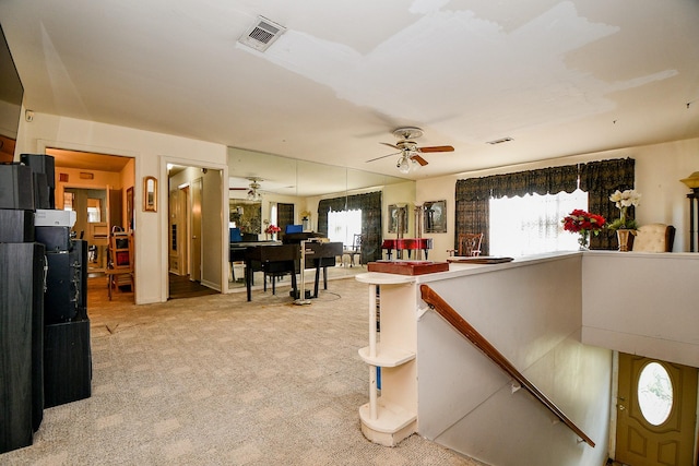 interior space featuring ceiling fan