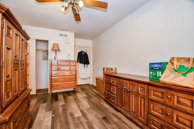 interior space with dark hardwood / wood-style flooring and ceiling fan