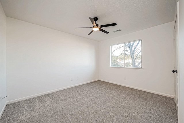 unfurnished room featuring carpet flooring, a textured ceiling, and ceiling fan