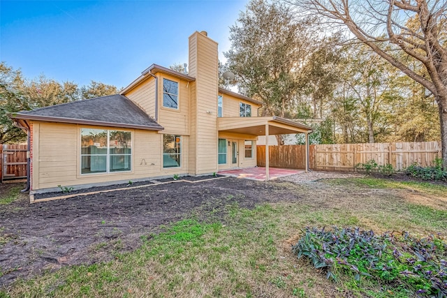 back of property featuring a patio area