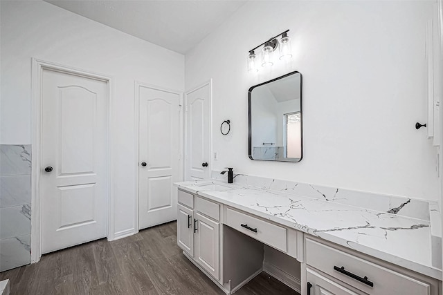 bathroom featuring hardwood / wood-style floors and vanity