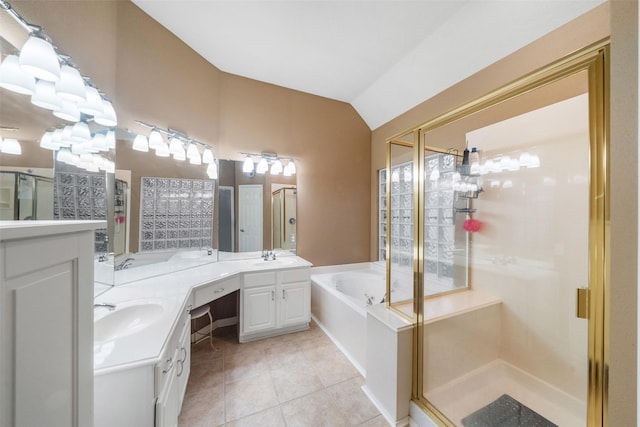 bathroom with tile patterned floors, vanity, shower with separate bathtub, and vaulted ceiling