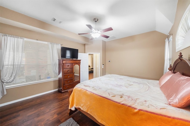 bedroom with lofted ceiling, ceiling fan, and dark wood-type flooring