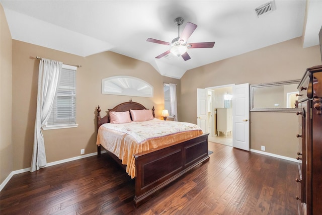 bedroom with ceiling fan, dark wood-type flooring, and vaulted ceiling