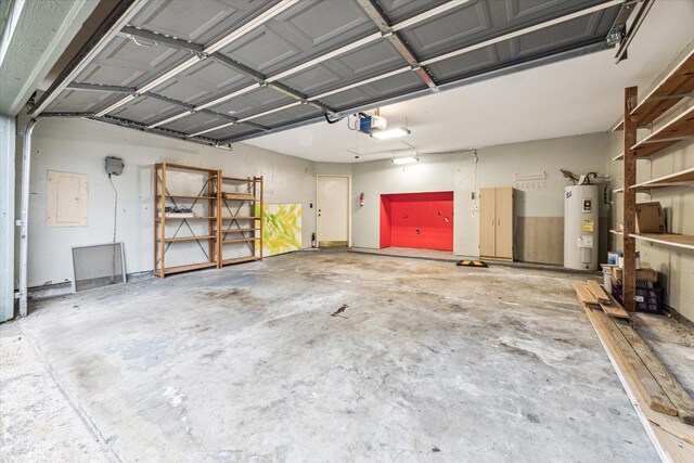 garage featuring electric panel, a garage door opener, and water heater