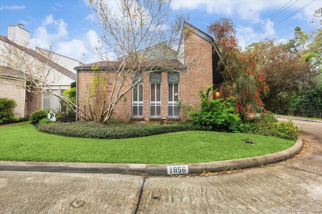 view of side of property featuring a yard