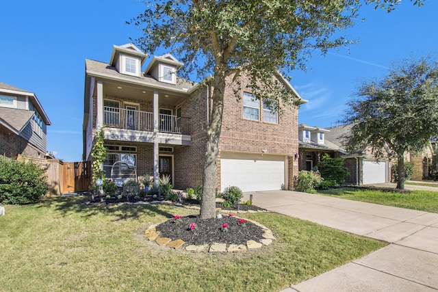 view of front of property with a front yard and a garage