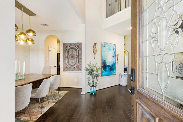 foyer entrance featuring dark wood-type flooring