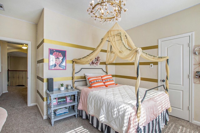 bedroom with carpet and an inviting chandelier