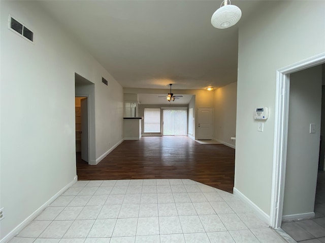 spare room with light tile patterned floors and ceiling fan