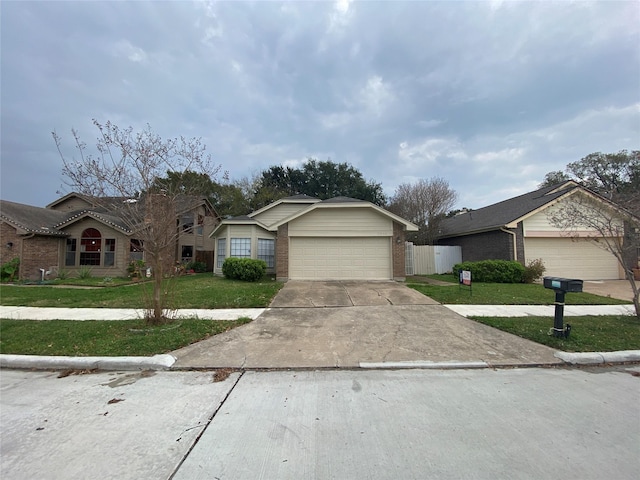 single story home with a front lawn and a garage