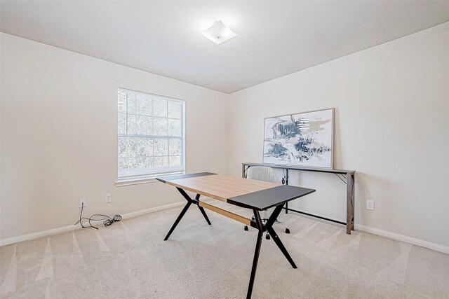 home office featuring light colored carpet