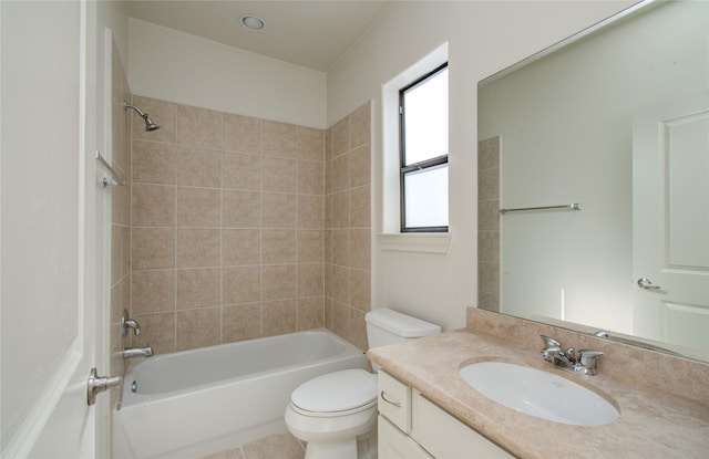 full bathroom with vanity, tile patterned floors, tiled shower / bath combo, and toilet