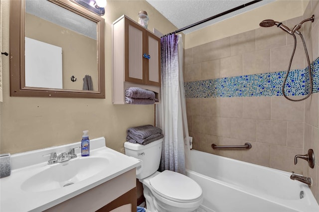 full bathroom featuring shower / bath combo with shower curtain, vanity, a textured ceiling, and toilet