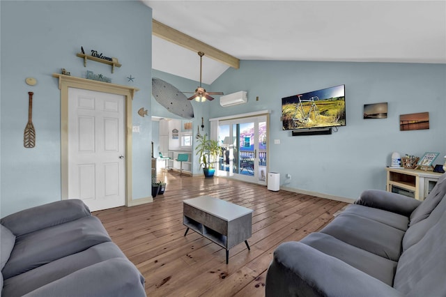 living room featuring a wall mounted air conditioner, lofted ceiling with beams, ceiling fan, and light wood-type flooring