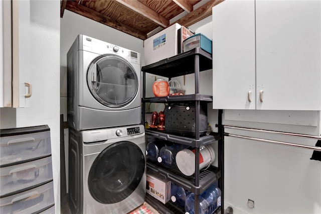 clothes washing area with stacked washer / drying machine