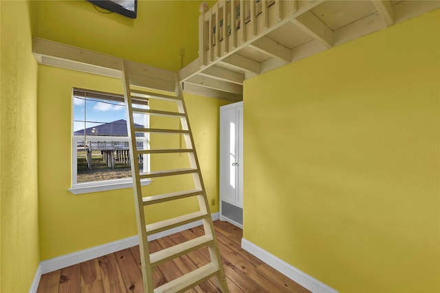 stairway with wood-type flooring