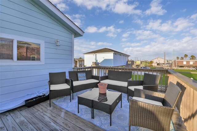 wooden terrace featuring a water view and an outdoor hangout area