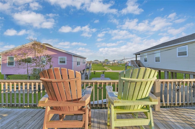 wooden deck with a lawn