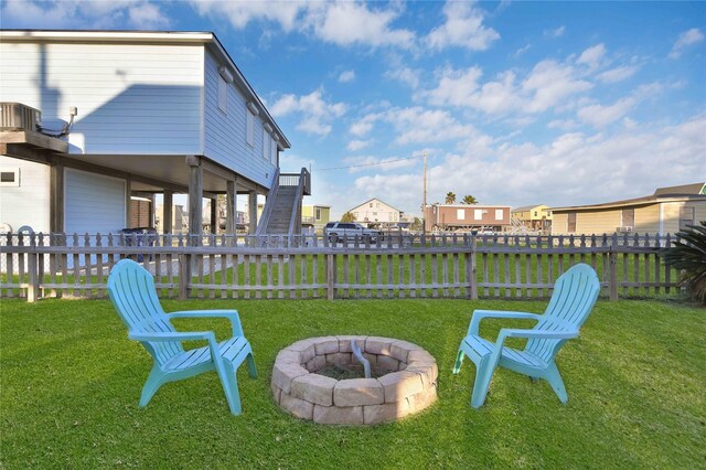 view of yard featuring an outdoor fire pit