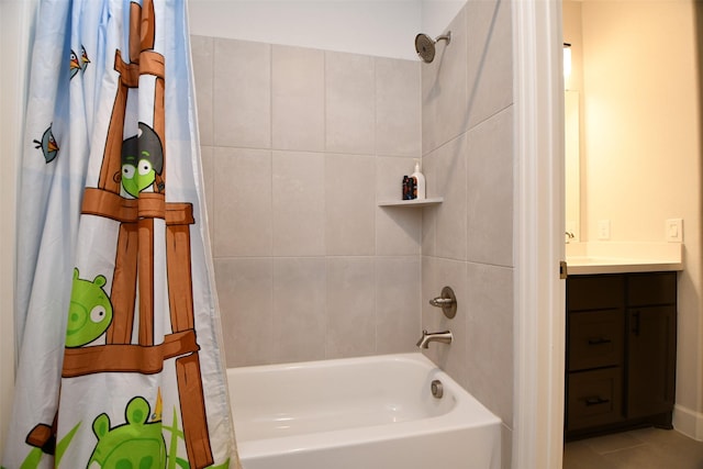 bathroom with tile patterned flooring, vanity, and shower / tub combo