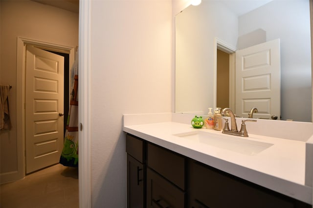 bathroom featuring tile patterned floors and vanity