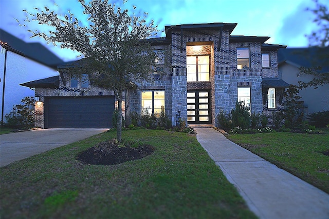 modern home with a front yard and a garage