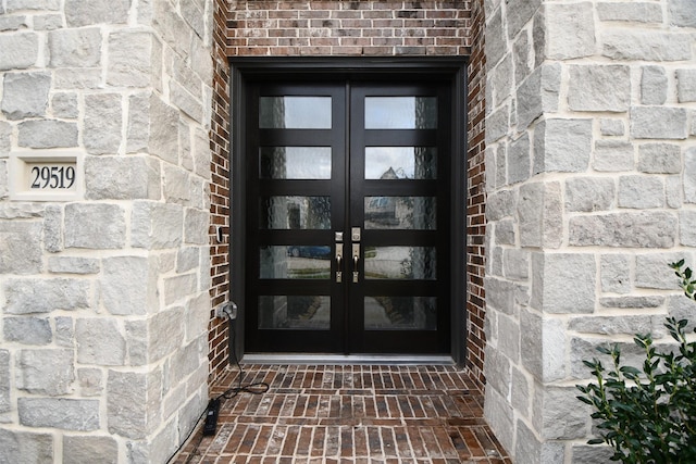 entrance to property featuring french doors