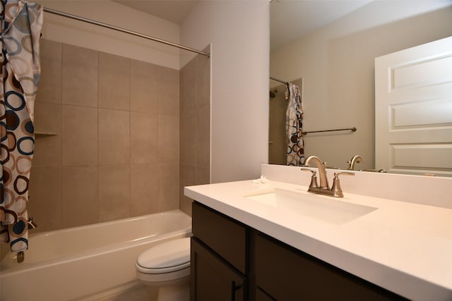 full bathroom featuring vanity, shower / bath combo, and toilet