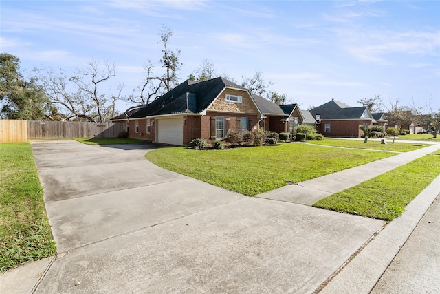 view of front of property with a front lawn and a garage