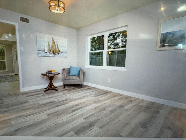 unfurnished room featuring light hardwood / wood-style flooring