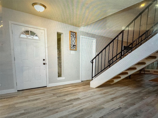 foyer featuring hardwood / wood-style flooring