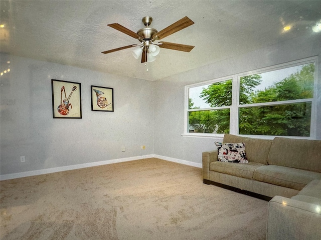 unfurnished room with ceiling fan and carpet floors