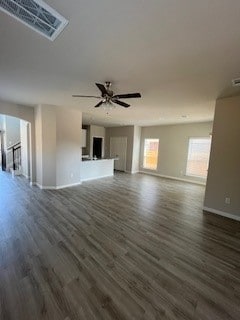 unfurnished living room with ceiling fan and dark hardwood / wood-style flooring