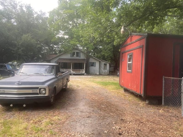 exterior space featuring a shed