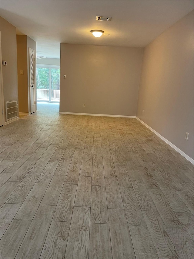 spare room featuring light hardwood / wood-style flooring