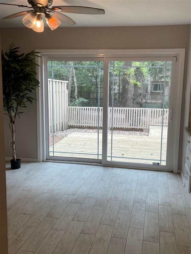 interior space featuring light hardwood / wood-style flooring and ceiling fan