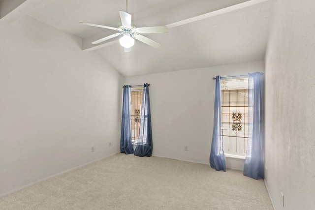 unfurnished room with light carpet, vaulted ceiling, and ceiling fan