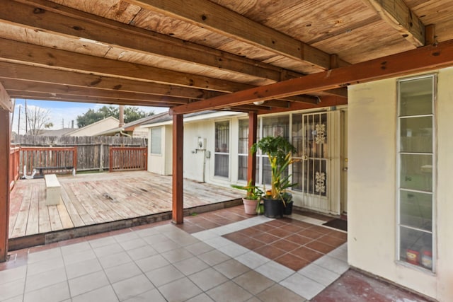 wooden terrace featuring a patio area