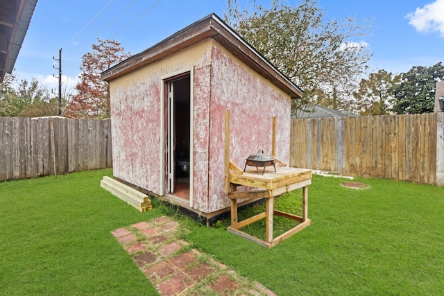 view of outdoor structure with a lawn