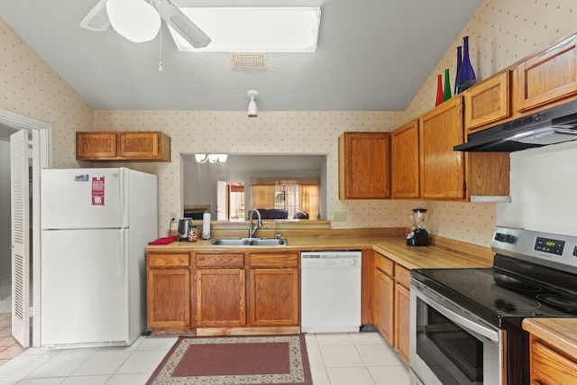 kitchen featuring white appliances, exhaust hood, sink, ceiling fan, and light tile patterned flooring