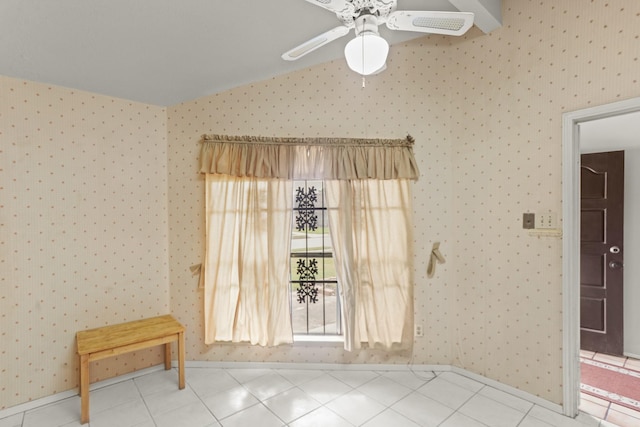 tiled empty room featuring ceiling fan