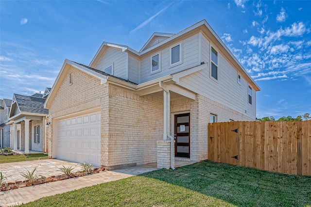 view of front of home featuring a front lawn and a garage