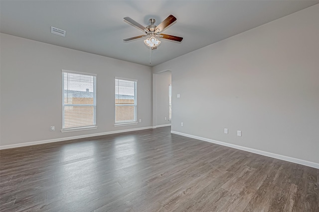 spare room with hardwood / wood-style flooring and ceiling fan