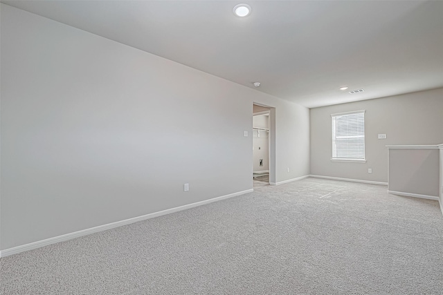 spare room with light colored carpet