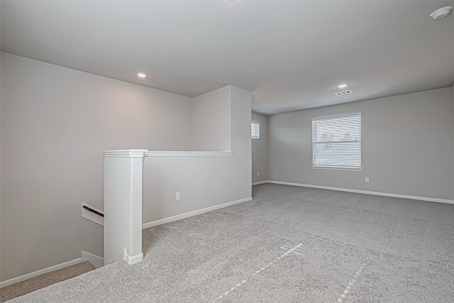 empty room with light colored carpet