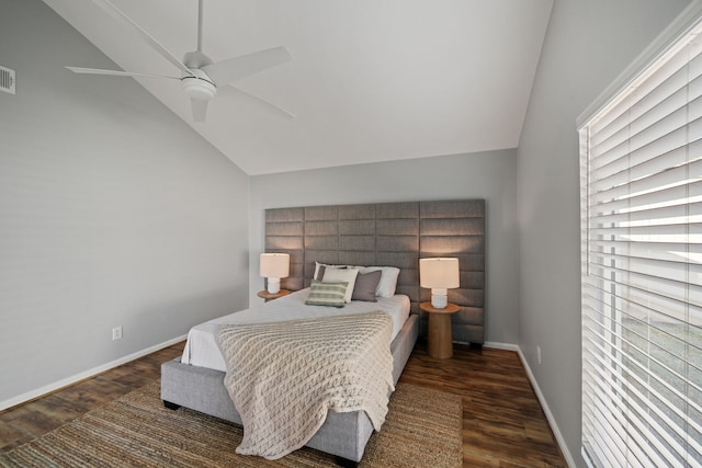 bedroom with dark hardwood / wood-style flooring, ceiling fan, and lofted ceiling