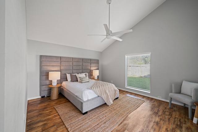 bedroom featuring ceiling fan, dark hardwood / wood-style flooring, and high vaulted ceiling